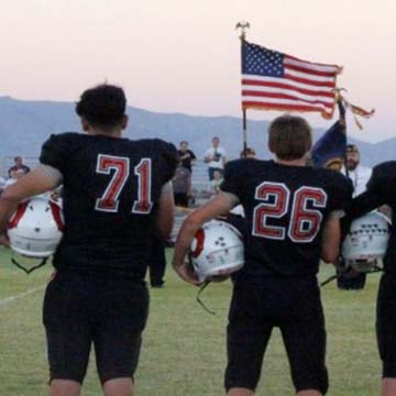 Football players on sidelines