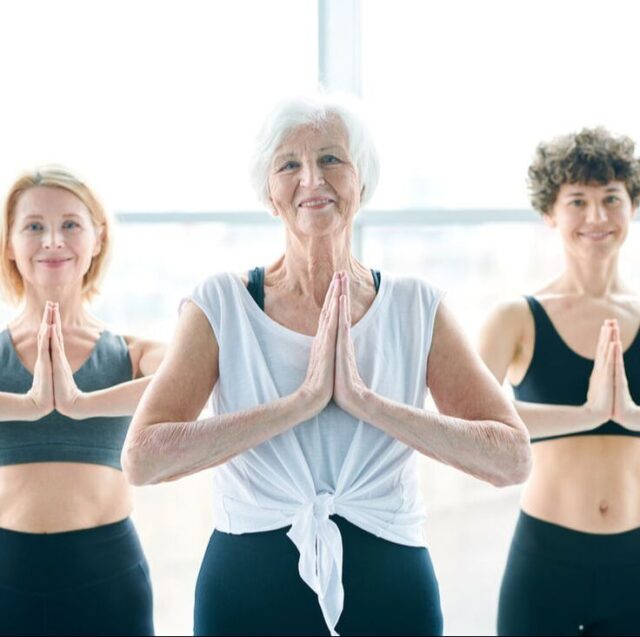 Senior women in yoga pose